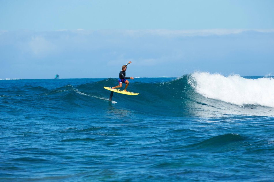 Kai Lenny surfs in Fiji on a hydrofoil surfboard.